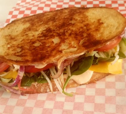 Mother Hazel’s “You Gotta Try It” Sandwich loaded with fresh organic vegetables on grilled bread

